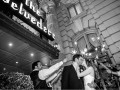 bride and groom kissing outside Belvedere Hotel