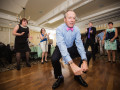 wedding guest dancing low to ground